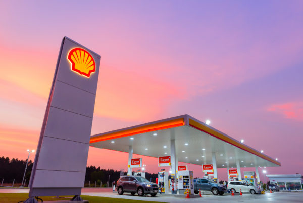 Photograph of a gas station during sunset.