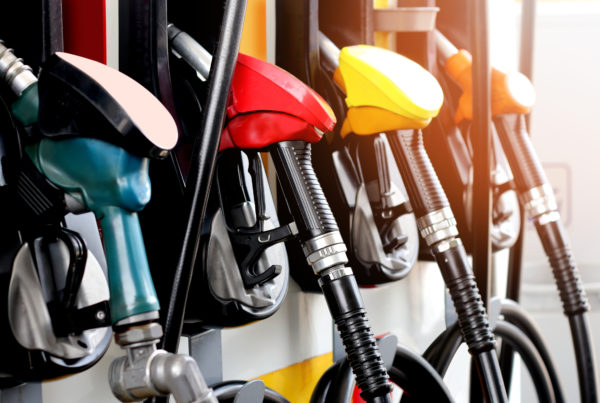 Fuel pumps at a gas station symbolizing benefits of fuel management system.