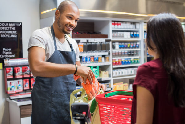 Customer checking out at register using loyalty program